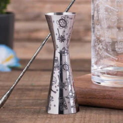 Urban Bar Etched Tiki Aero Stainless Steel Cocktail Jigger - 1oz & 2oz -Bar Supplies 18002293 Urban Bar Etched Tiki Aero Stainless Steel Cocktail Jigger 1oz 2oz 2 09951.1592498785